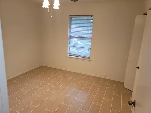 a view of a room that has a window in it