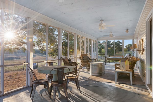 6020 Valley View Lane Brenham, TX 77833 - Photo 24 of 29 a view of a dining room with furniture large windows and wooden floor