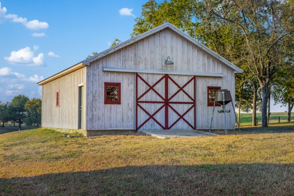 6020 Valley View Lane Brenham, TX 77833 - Photo 26 of 29 a view of backyard of house with wooden fence