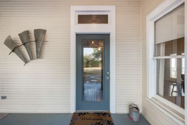 a view of an entryway with wooden floor