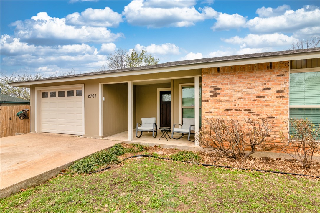 a view of house with backyard of the space