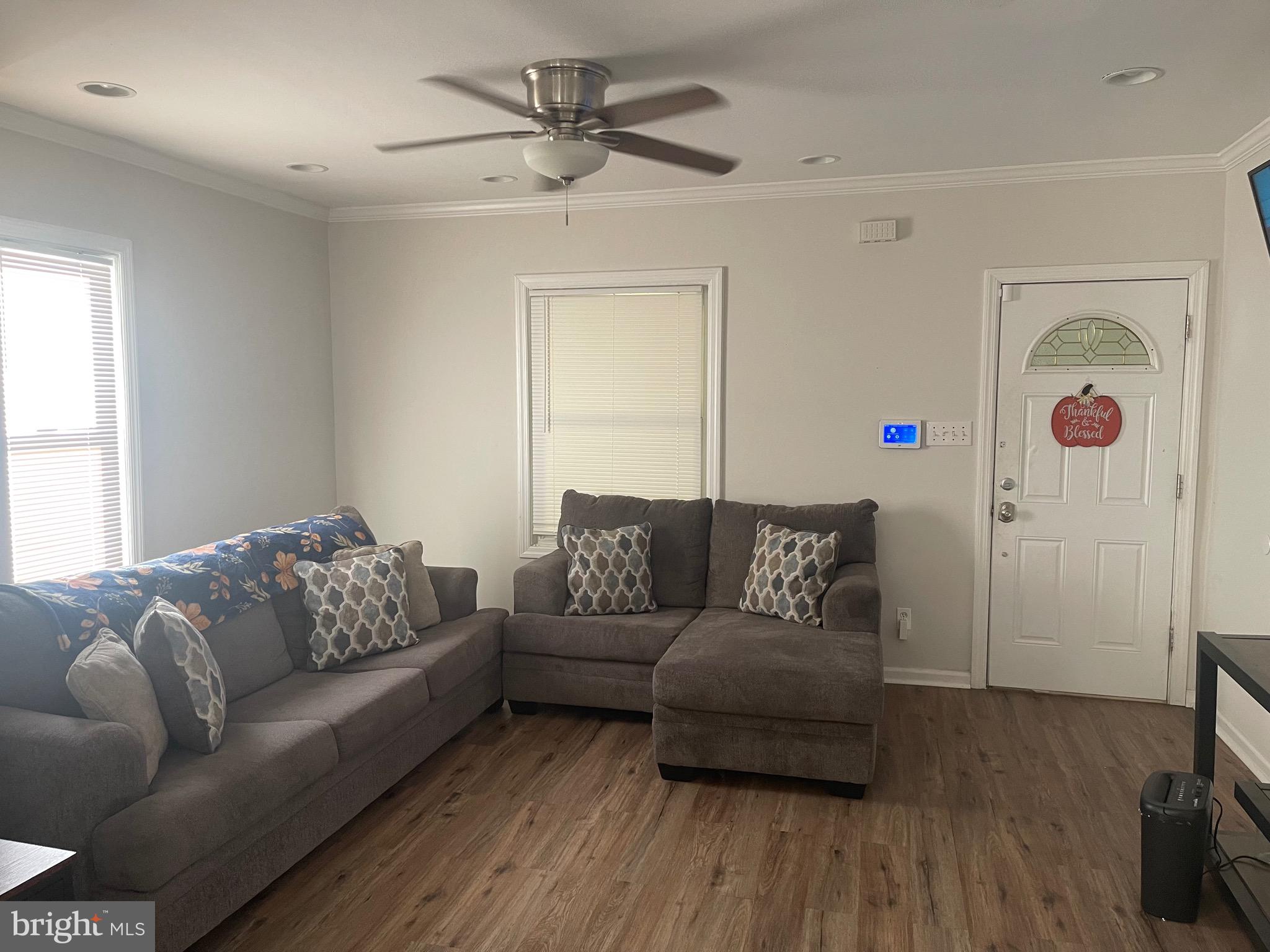 323 High Street Westville, NJ 08093 - Photo 14 of 33 a living room with furniture and a wooden floor
