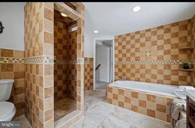 a bathroom with a glass door shower