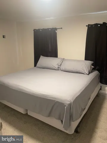 a bedroom with a bed and tv
