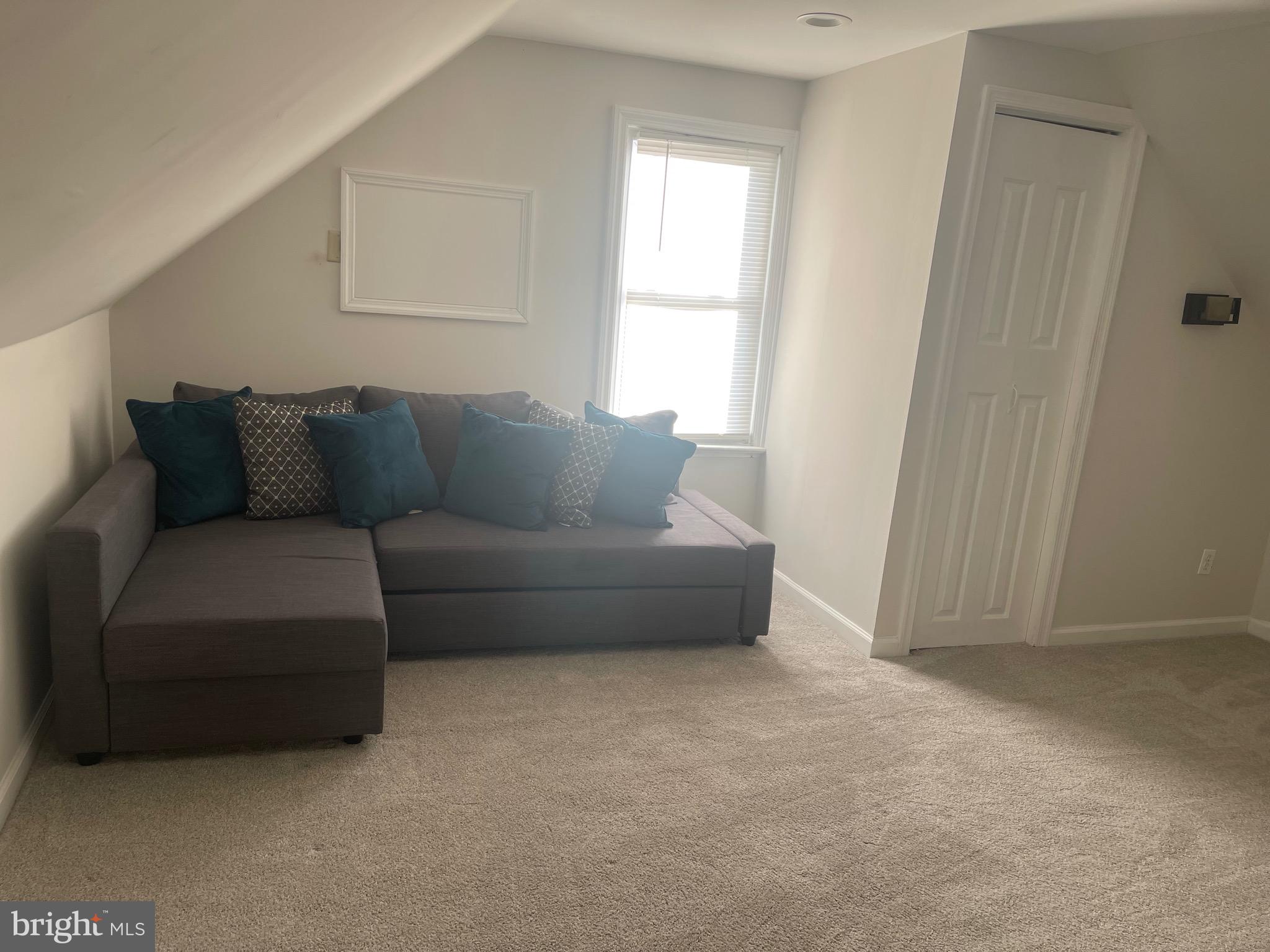 323 High Street Westville, NJ 08093 - Photo 24 of 33 a living room with furniture and a window