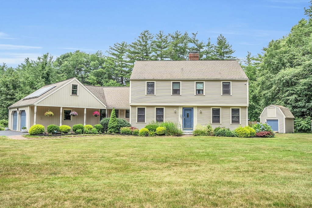 26 Wilder Road Sterling, MA 01564 - Photo 2 of 28 a front view of a house with a garden
