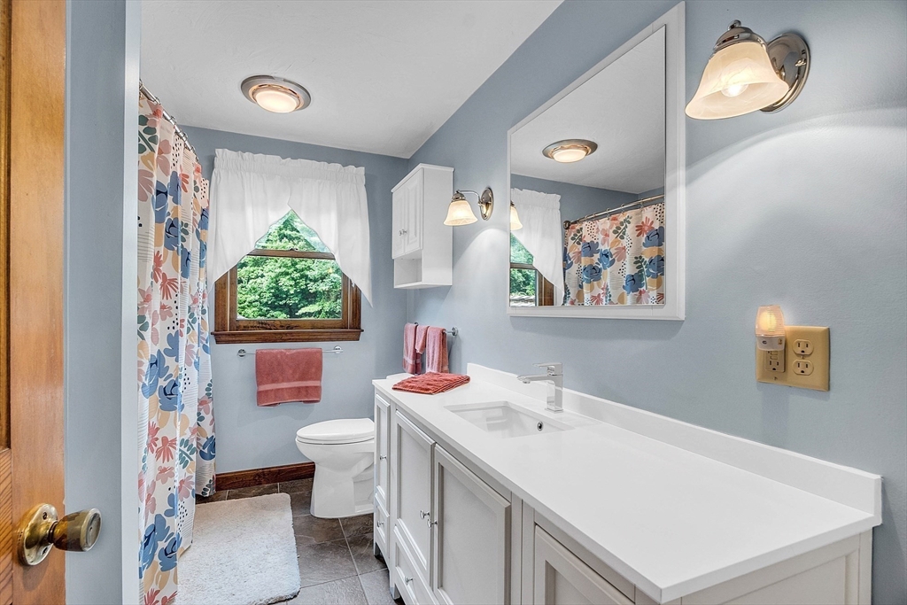 26 Wilder Road Sterling, MA 01564 - Photo 21 of 28 a bathroom with a sink mirror and toilet