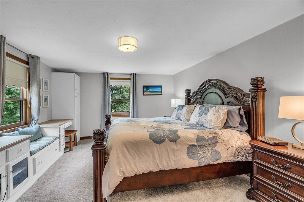 26 Wilder Road Sterling, MA 01564 - Photo 22 of 28 a bedroom with a large bed and a large window