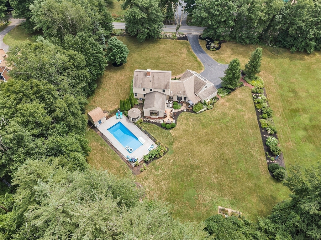 26 Wilder Road Sterling, MA 01564 - Photo 25 of 28 a aerial view of a house with swimming pool and lake view