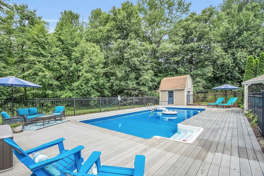 26 Wilder Road Sterling, MA 01564 - Photo 6 of 28 a view of a swimming pool with a patio and a yard