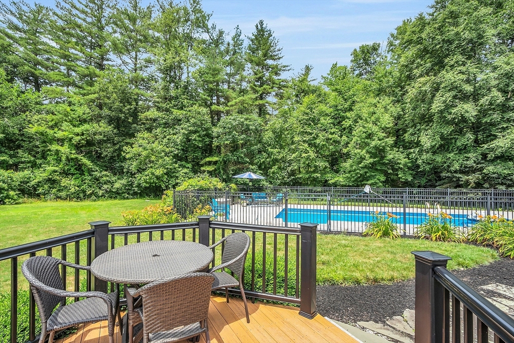 26 Wilder Road Sterling, MA 01564 - Photo 7 of 28 a view of a chair and tables on the roof deck