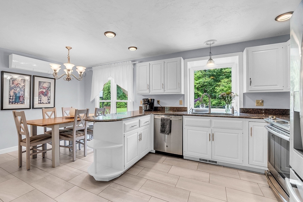 26 Wilder Road Sterling, MA 01564 - Photo 10 of 28 a kitchen with a stove a sink and cabinets