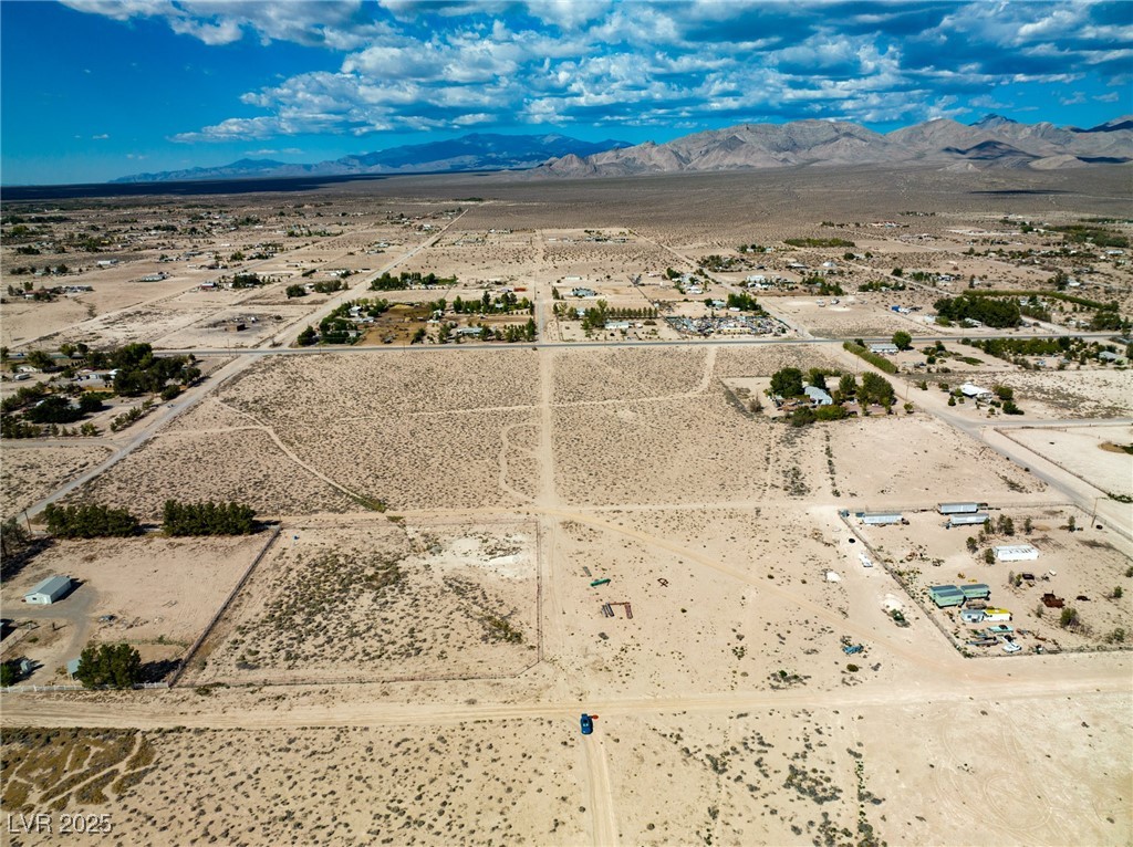 Marble Sandy Valley, NV 89019 - Photo 8 of 31 Aerial view featuring a rural view, a mountain view, and a desert view