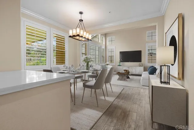 a view of a livingroom with furniture window and wooden floor