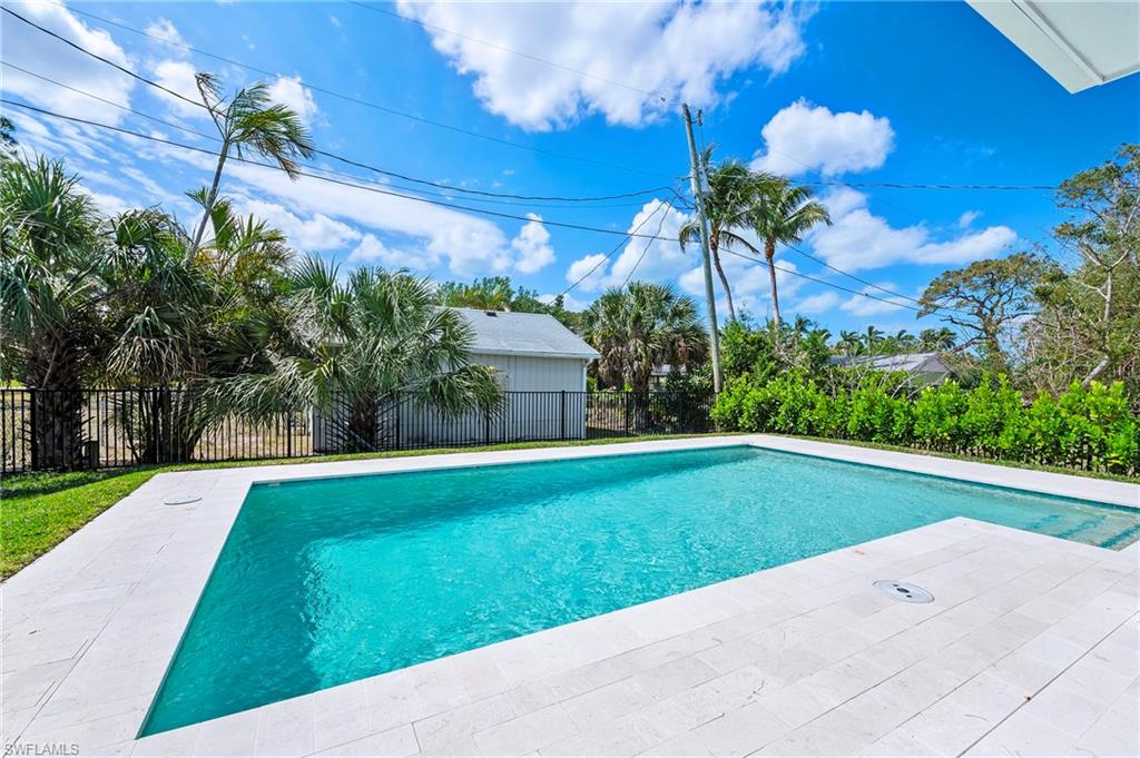 1134 Trail Terrace Drive Naples, FL 34103 - Photo 13 of 37 View of swimming pool featuring a fenced in pool, fence, and a patio