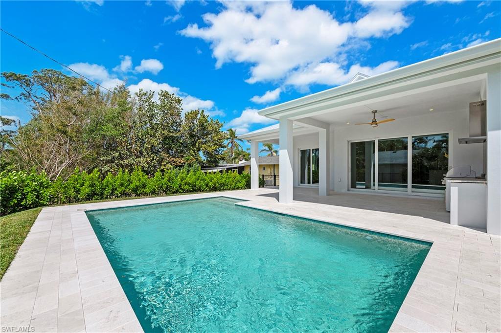 1134 Trail Terrace Drive Naples, FL 34103 - Photo 14 of 37 Pool featuring grilling area, area for grilling, ceiling fan, and a patio
