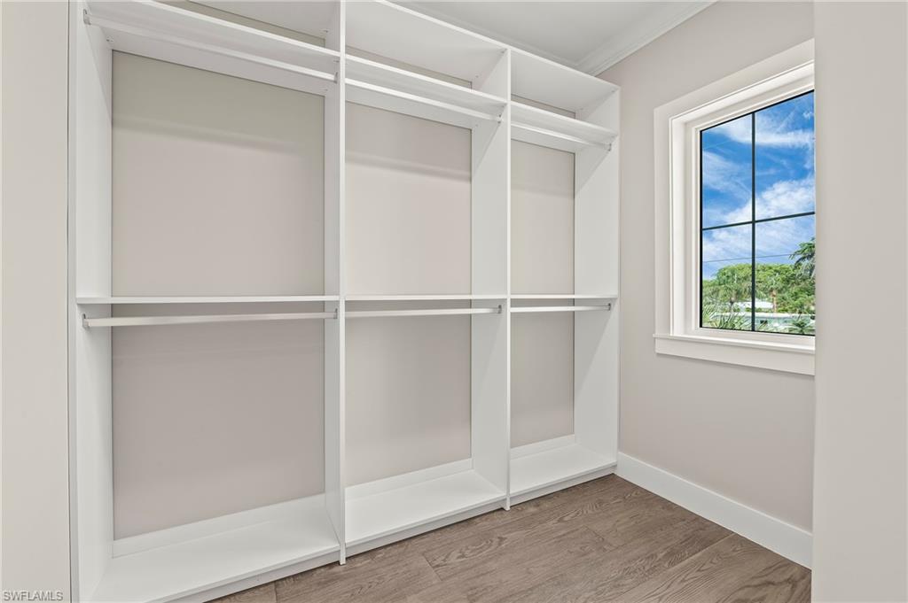 1134 Trail Terrace Drive Naples, FL 34103 - Photo 29 of 37 Spacious closet with wood finished floors