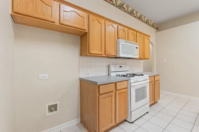an empty room with a ceiling fan and a window