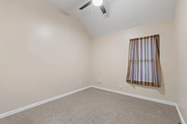 a view of empty room with windows