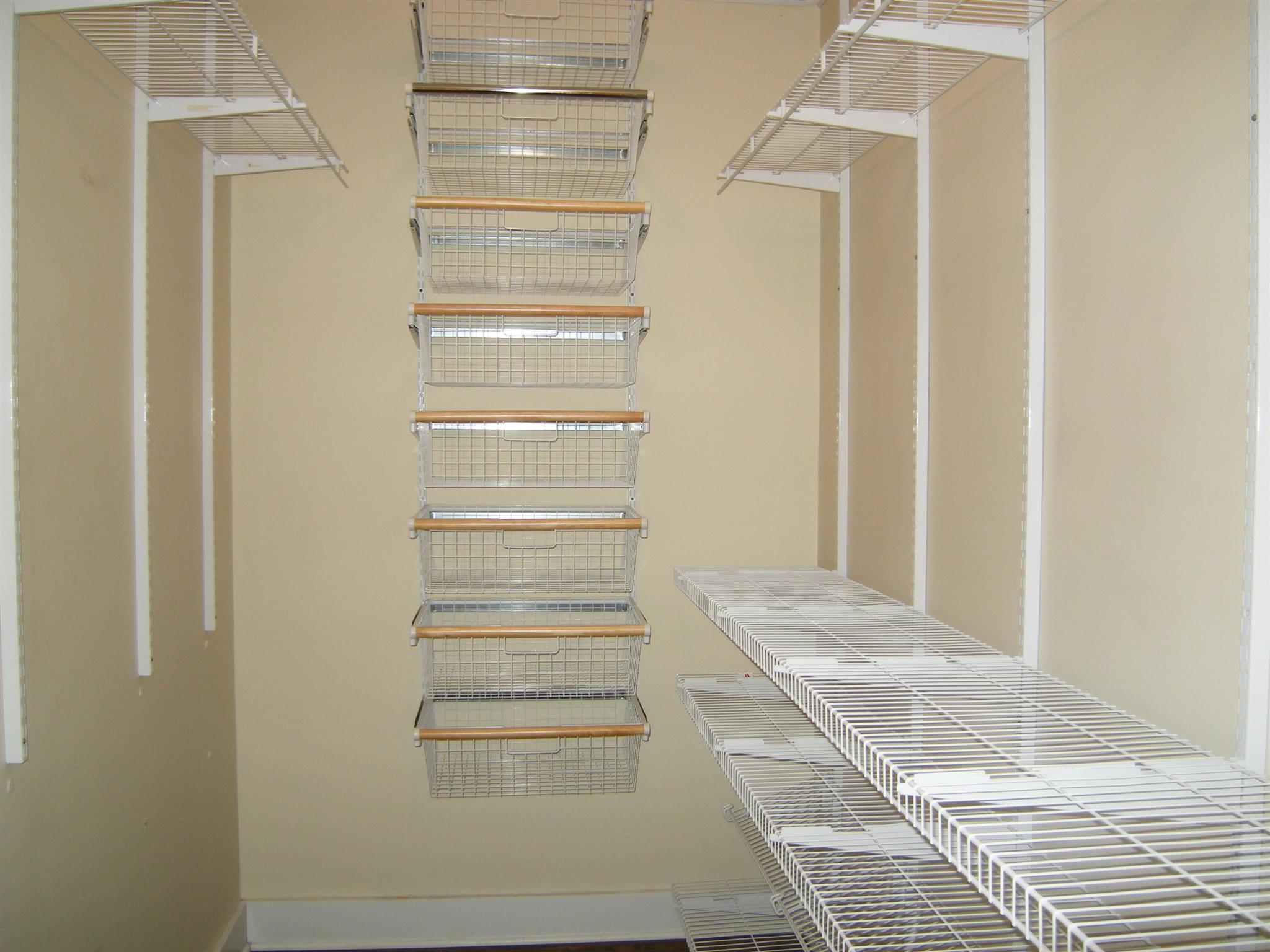 2798 Eugene Reed Road Woodbury, TN 37190 - Photo 11 of 25 Huge 13x6 walk-in closet with shelving and clothing baskets.