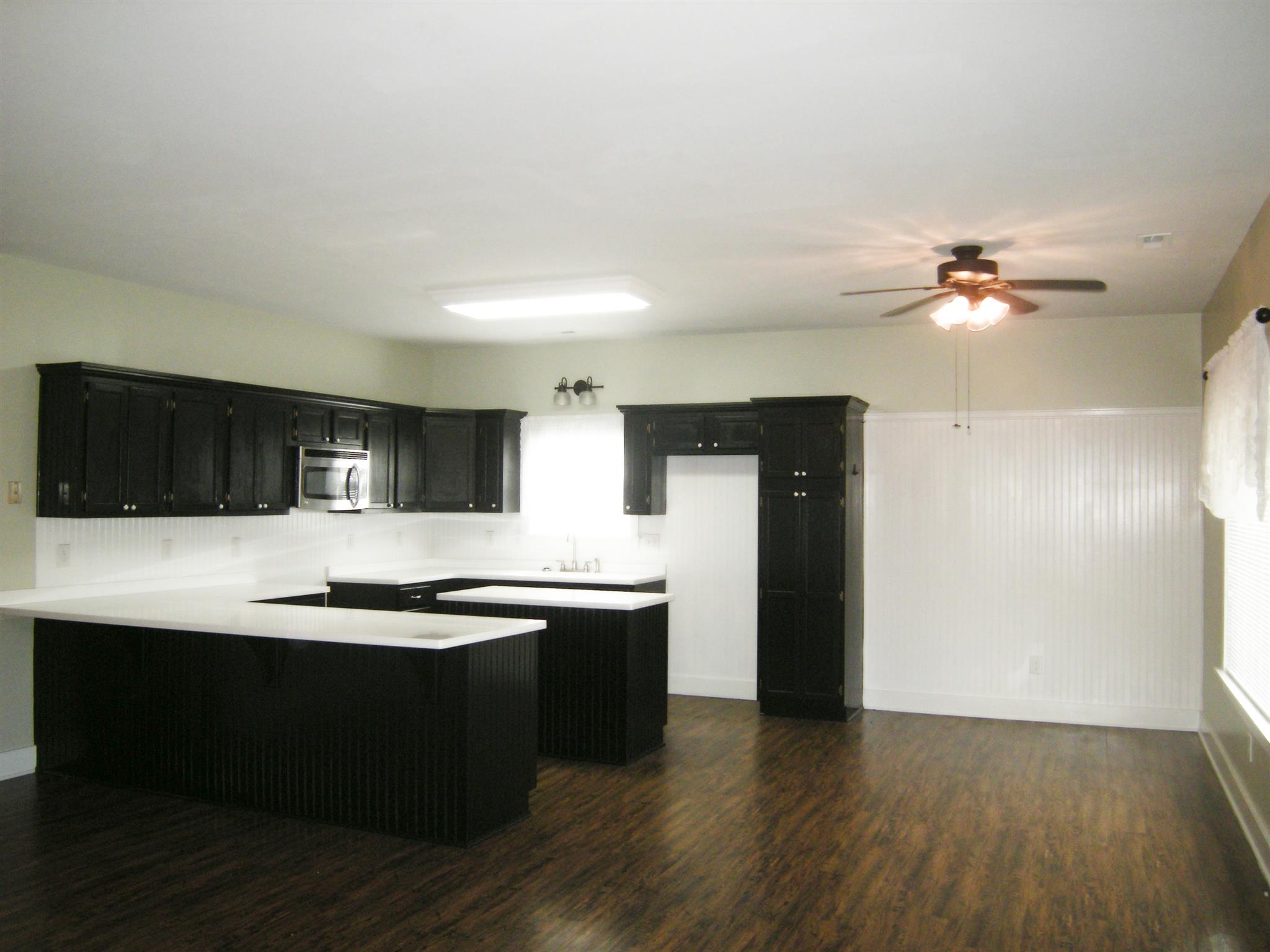 2798 Eugene Reed Road Woodbury, TN 37190 - Photo 6 of 25 Kitchen is open to great room. You’ll never feel alone when entertaining. Big table and china hutch will fit easily.