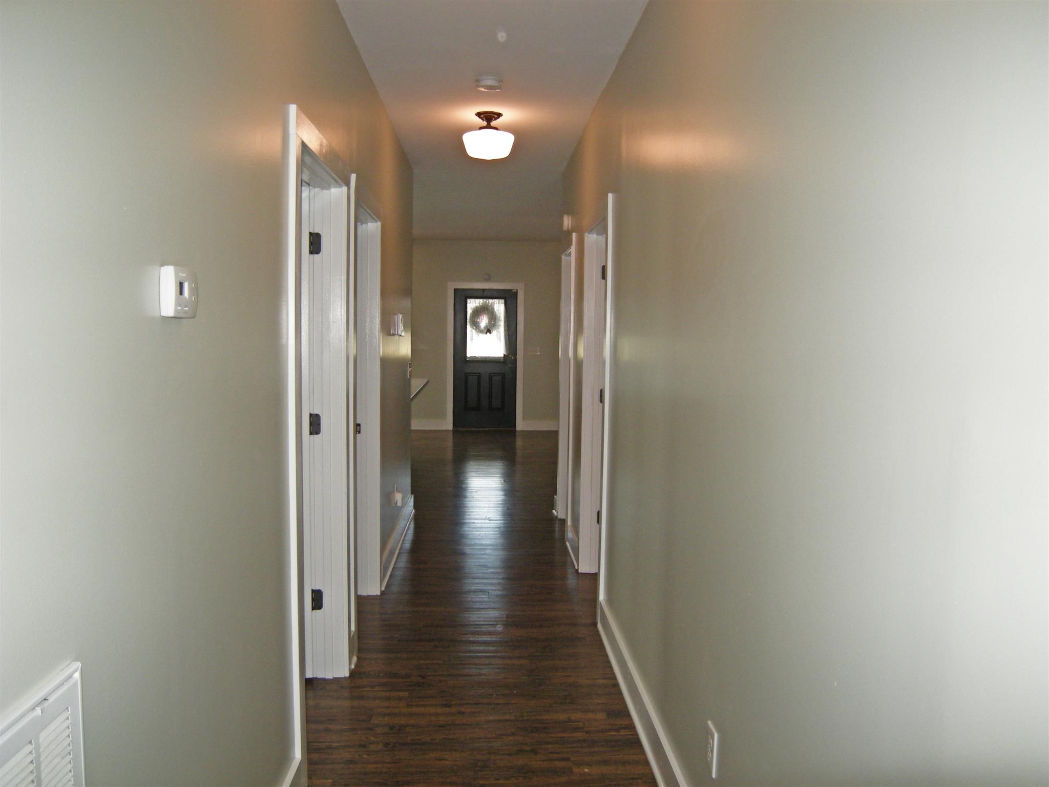 2798 Eugene Reed Road Woodbury, TN 37190 - Photo 8 of 25 Hall way leading to three bedrooms and summer kitchen/utility room.