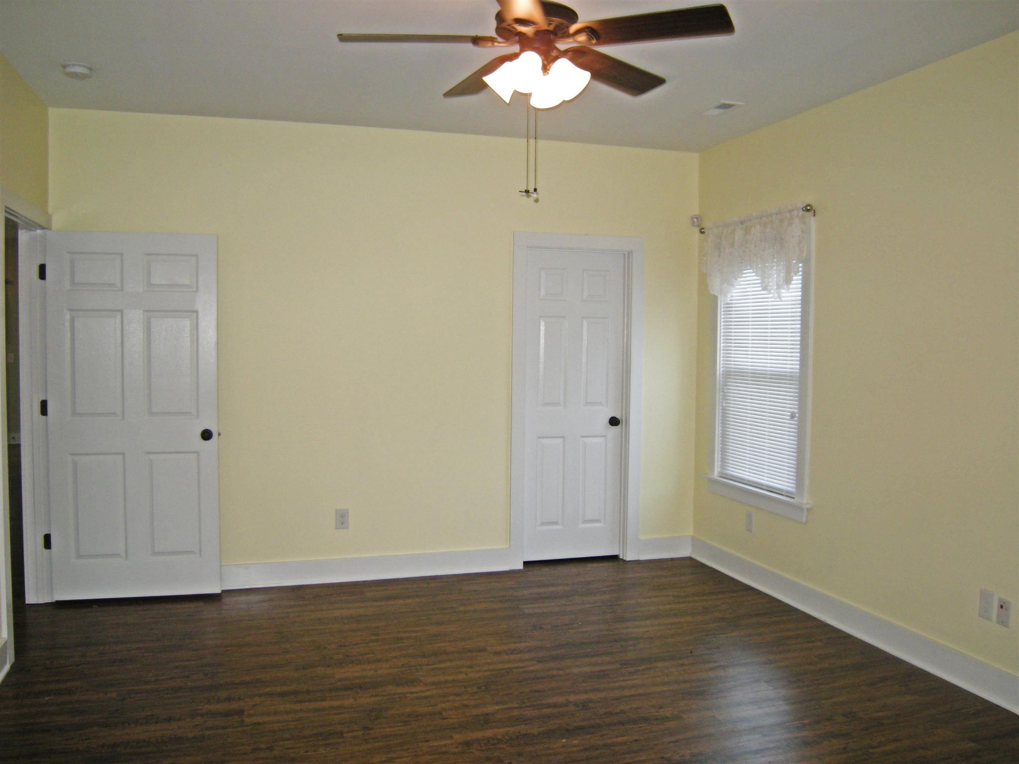 2798 Eugene Reed Road Woodbury, TN 37190 - Photo 10 of 25 Light and bright master bedroom with ceiling fan and laminate flooring.
