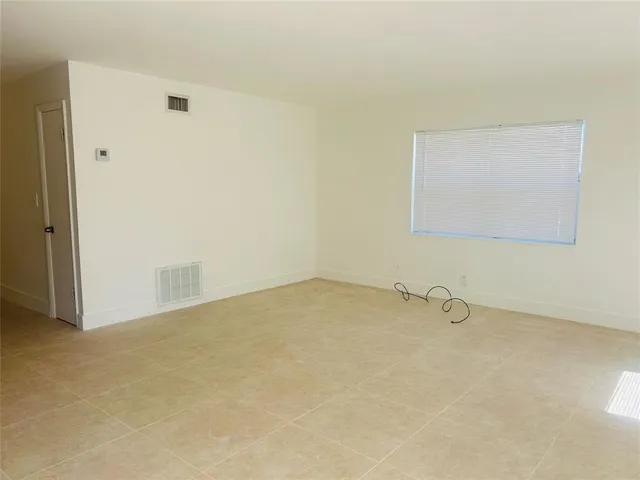 an empty room with a bench