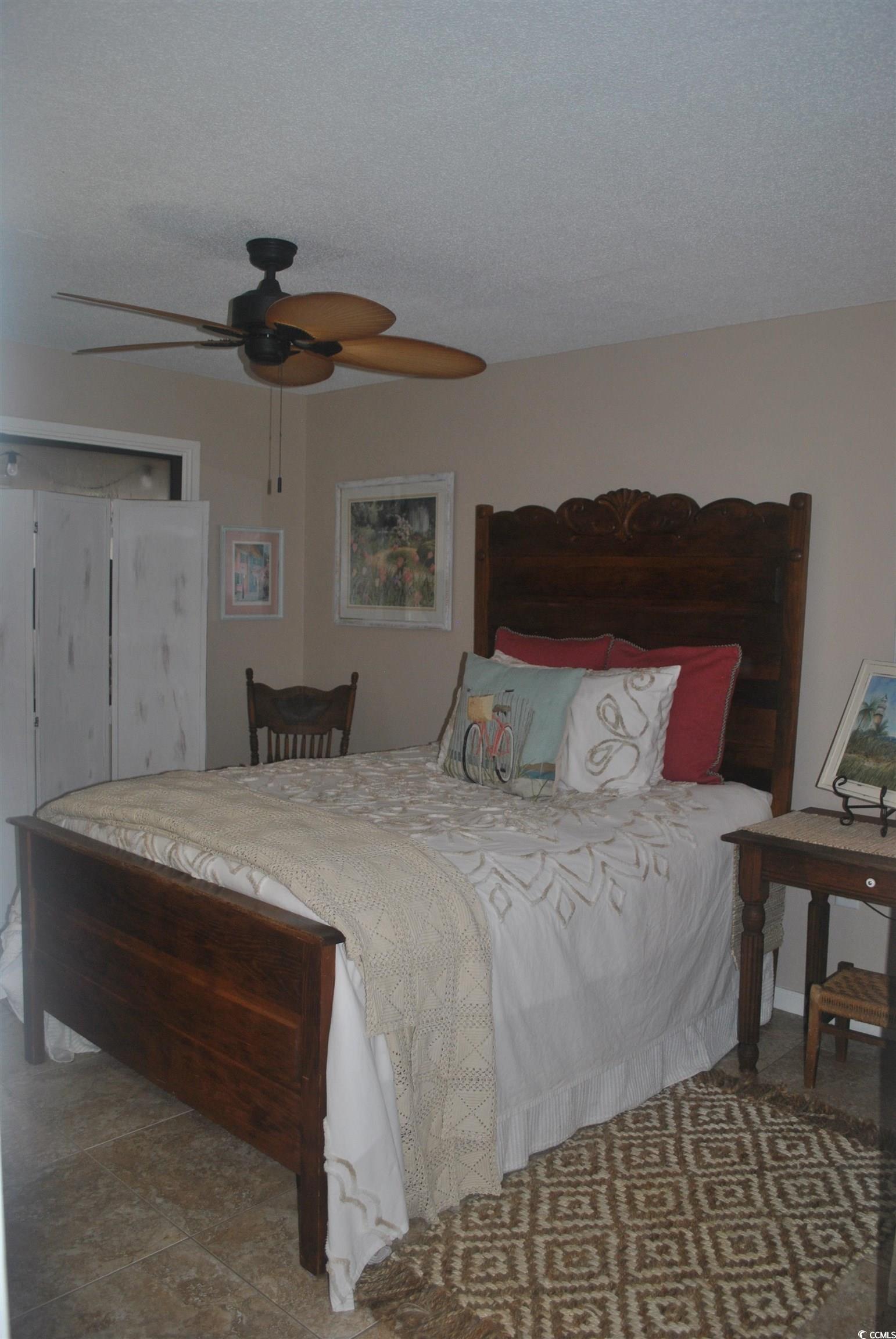 30 Little Point Road, Unit 33 Georgetown, SC 29440 - Photo 14 of 27 Bedroom with a textured ceiling and ceiling fan