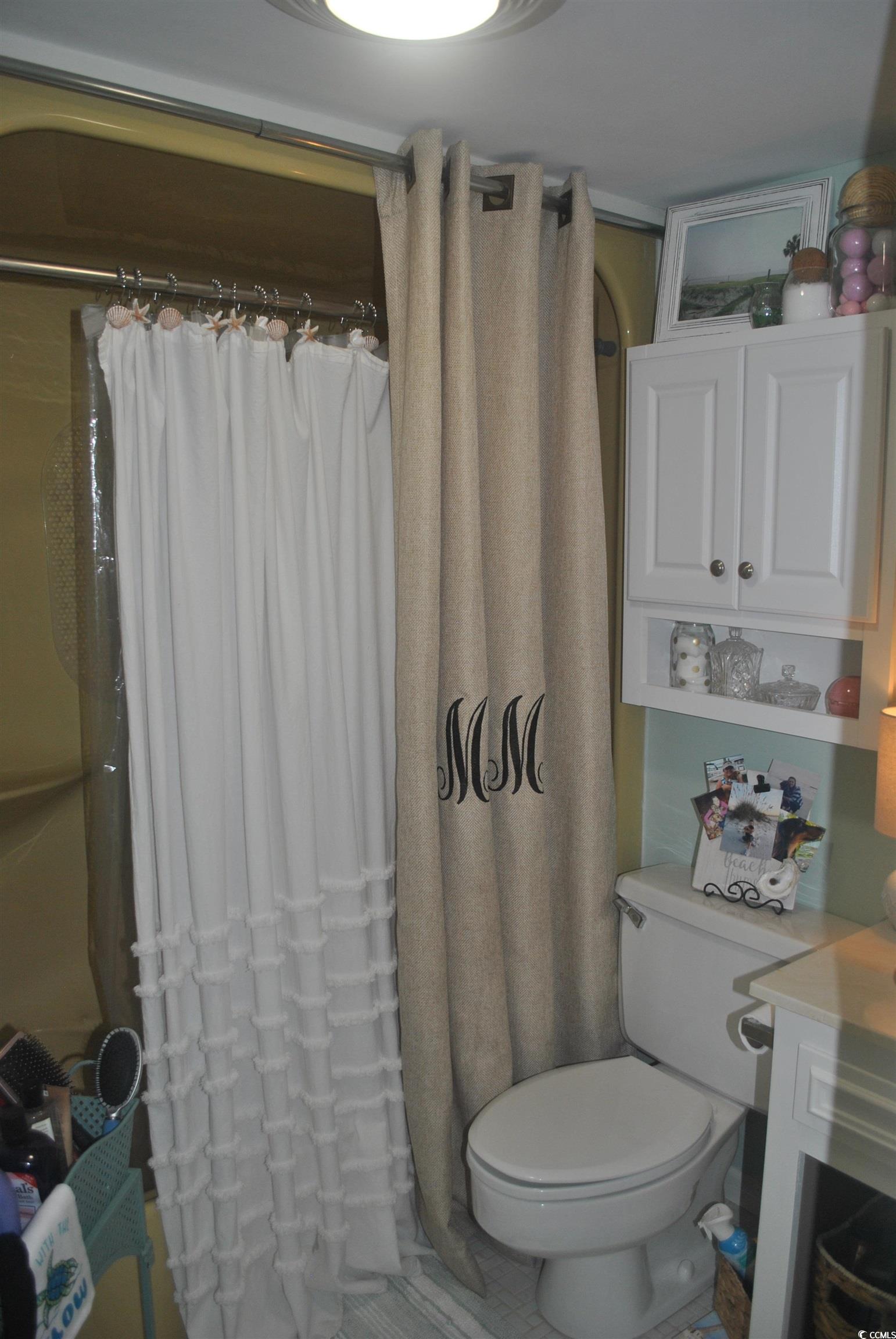 30 Little Point Road, Unit 33 Georgetown, SC 29440 - Photo 18 of 27 Bathroom with curtained shower and toilet