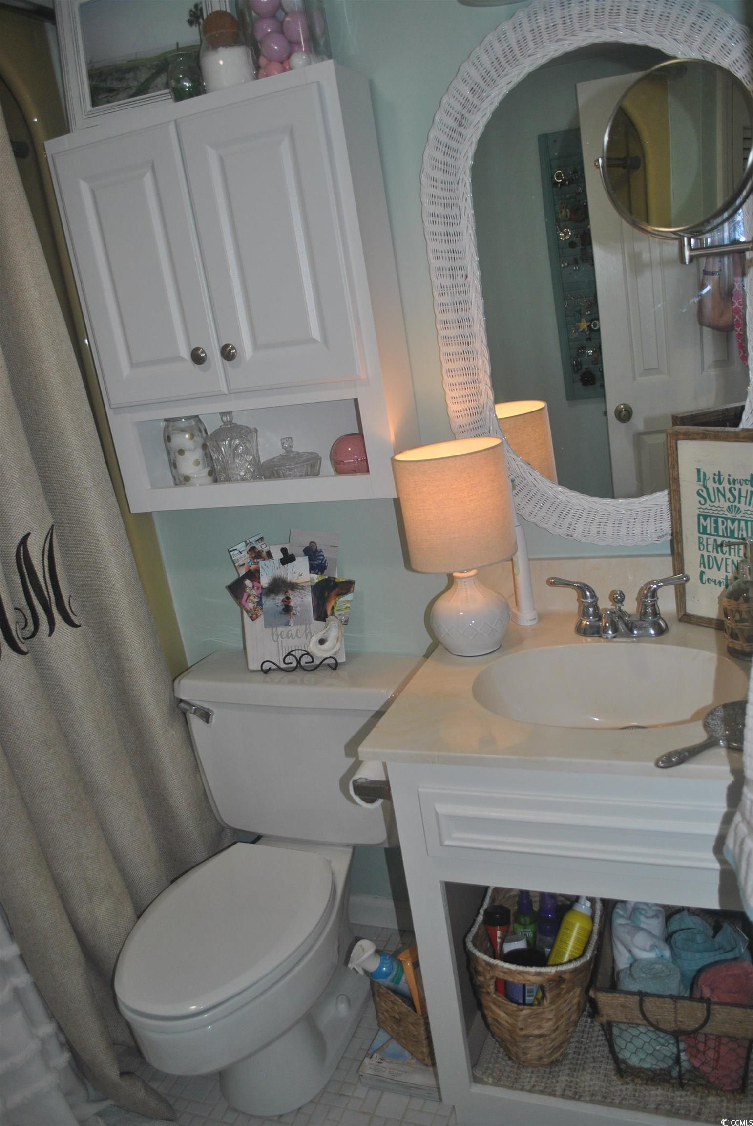30 Little Point Road, Unit 33 Georgetown, SC 29440 - Photo 19 of 27 Bathroom featuring toilet, vanity, and tile patter
