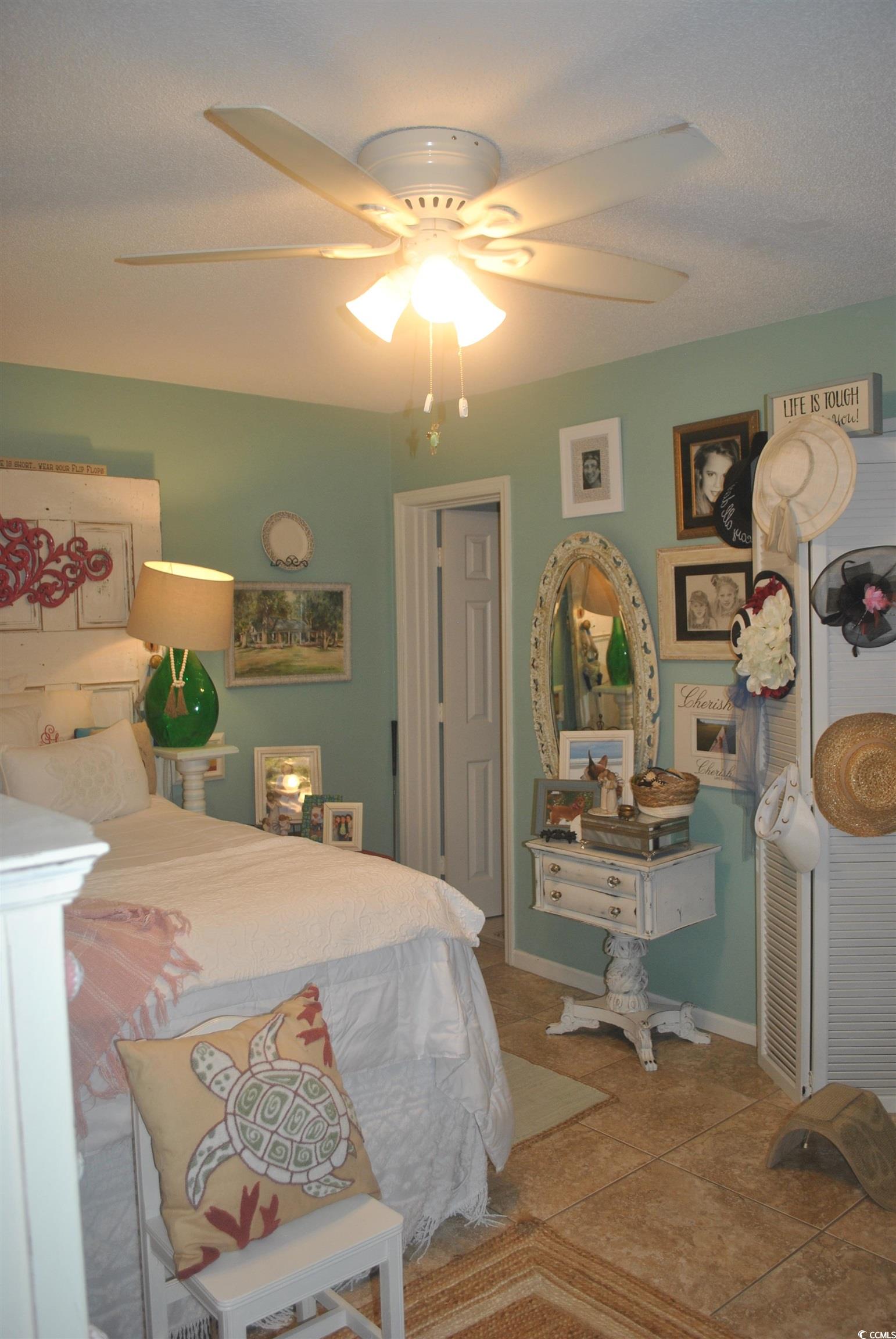 30 Little Point Road, Unit 33 Georgetown, SC 29440 - Photo 2 of 27 Tiled bedroom with ceiling fan
