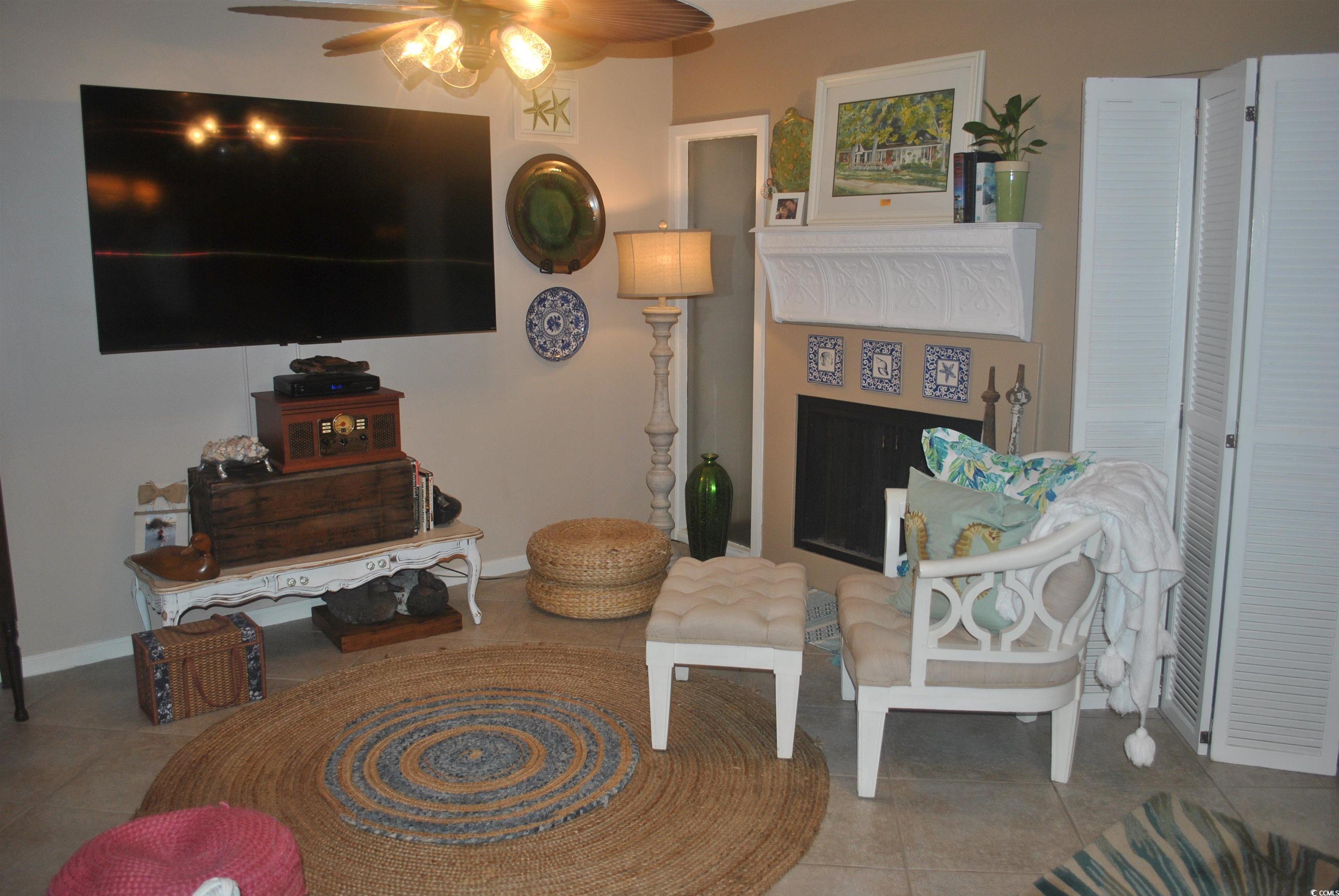 30 Little Point Road, Unit 33 Georgetown, SC 29440 - Photo 5 of 27 Tiled living room with ceiling fan
