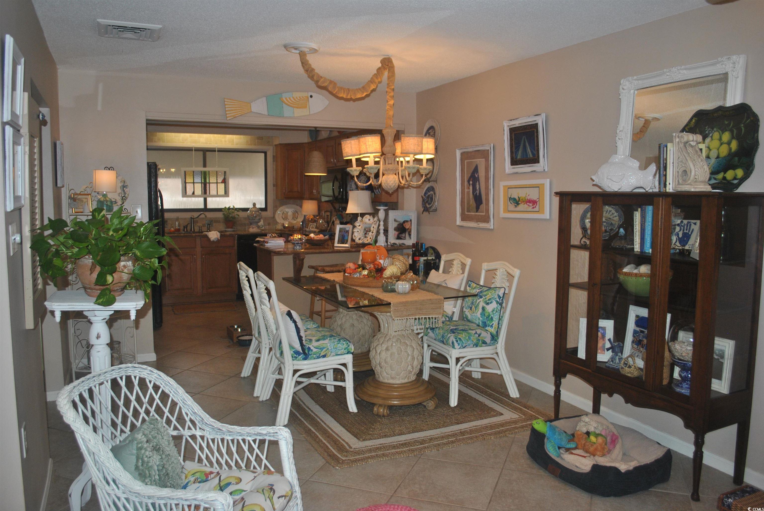 30 Little Point Road, Unit 33 Georgetown, SC 29440 - Photo 6 of 27 Dining area with light tile patterned floors and a
