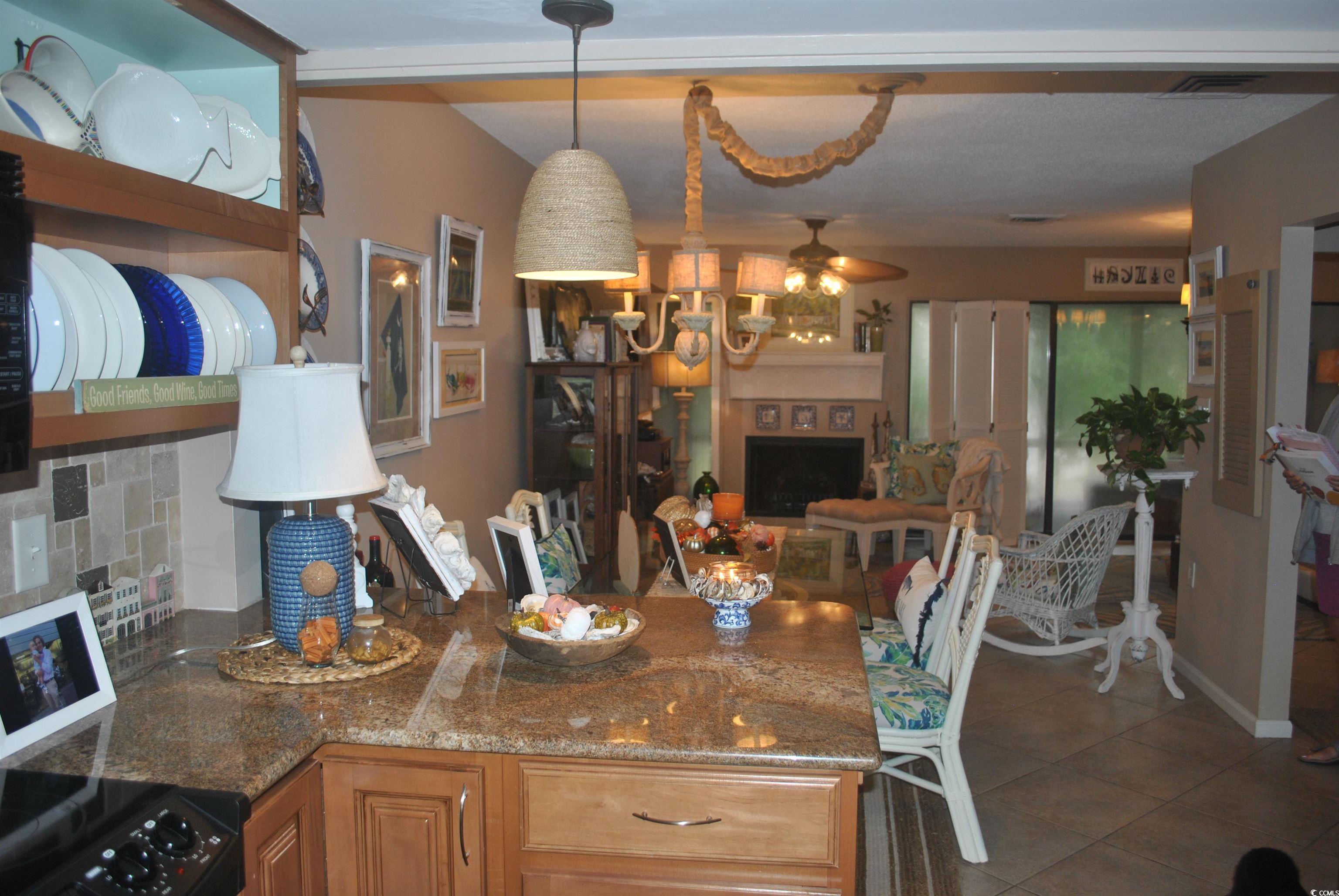 30 Little Point Road, Unit 33 Georgetown, SC 29440 - Photo 8 of 27 Tiled dining area featuring ceiling fan