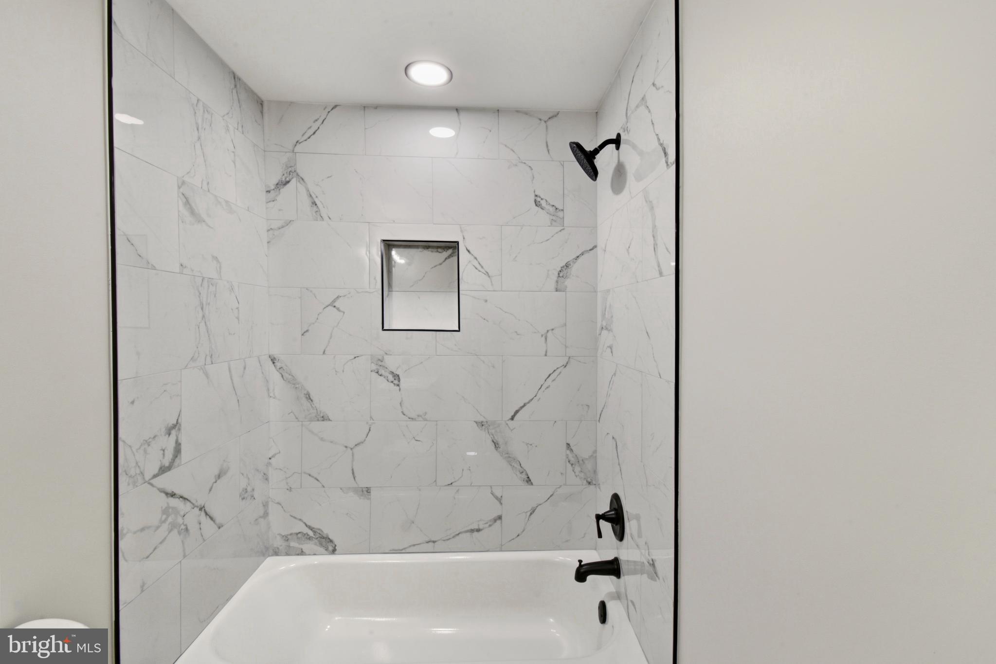 620 B Street Staunton, VA 24401 - Photo 15 of 26 a bathroom with a shower and a bath tub