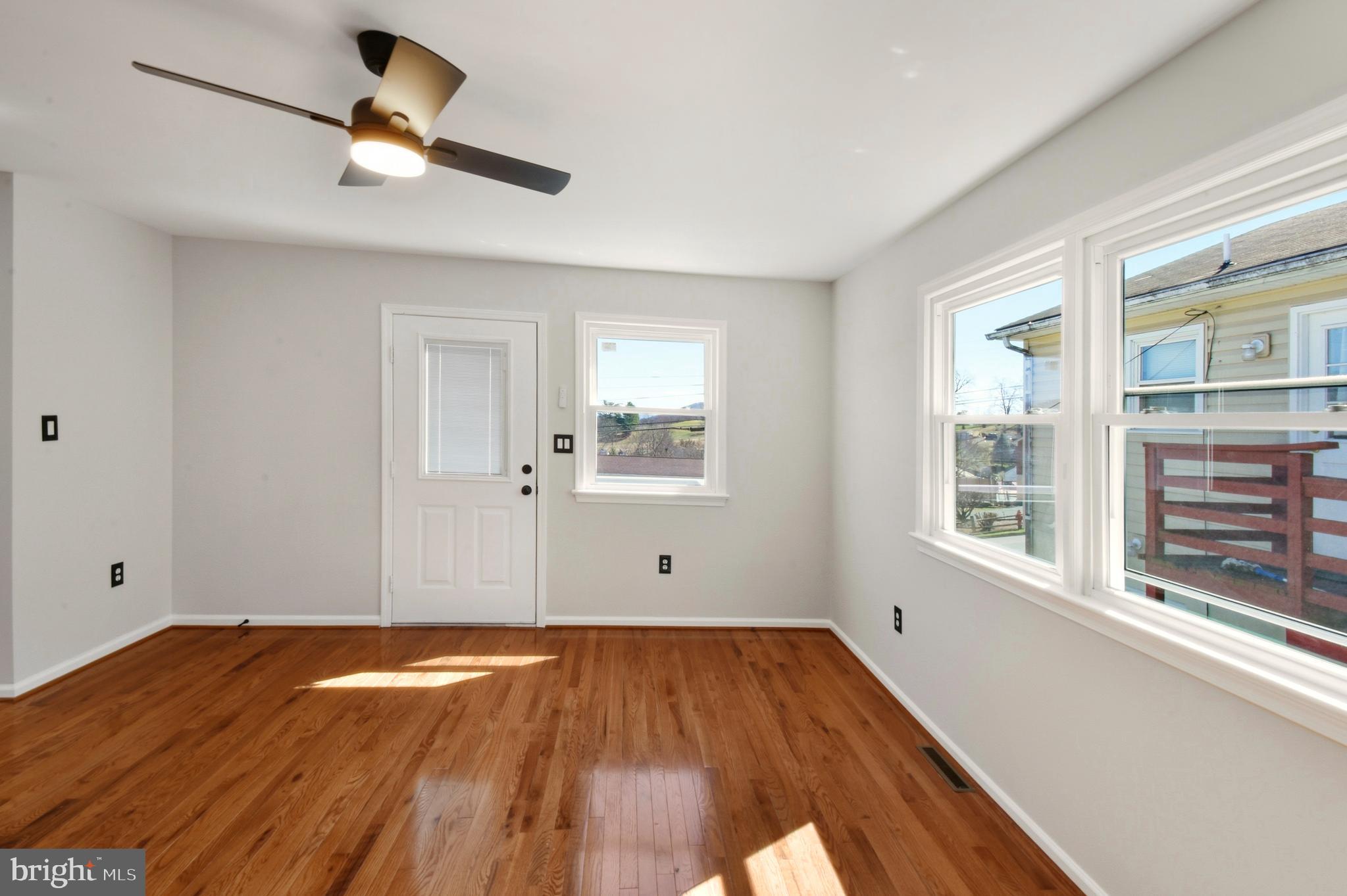620 B Street Staunton, VA 24401 - Photo 6 of 26 a view of empty room with wooden floor and fan