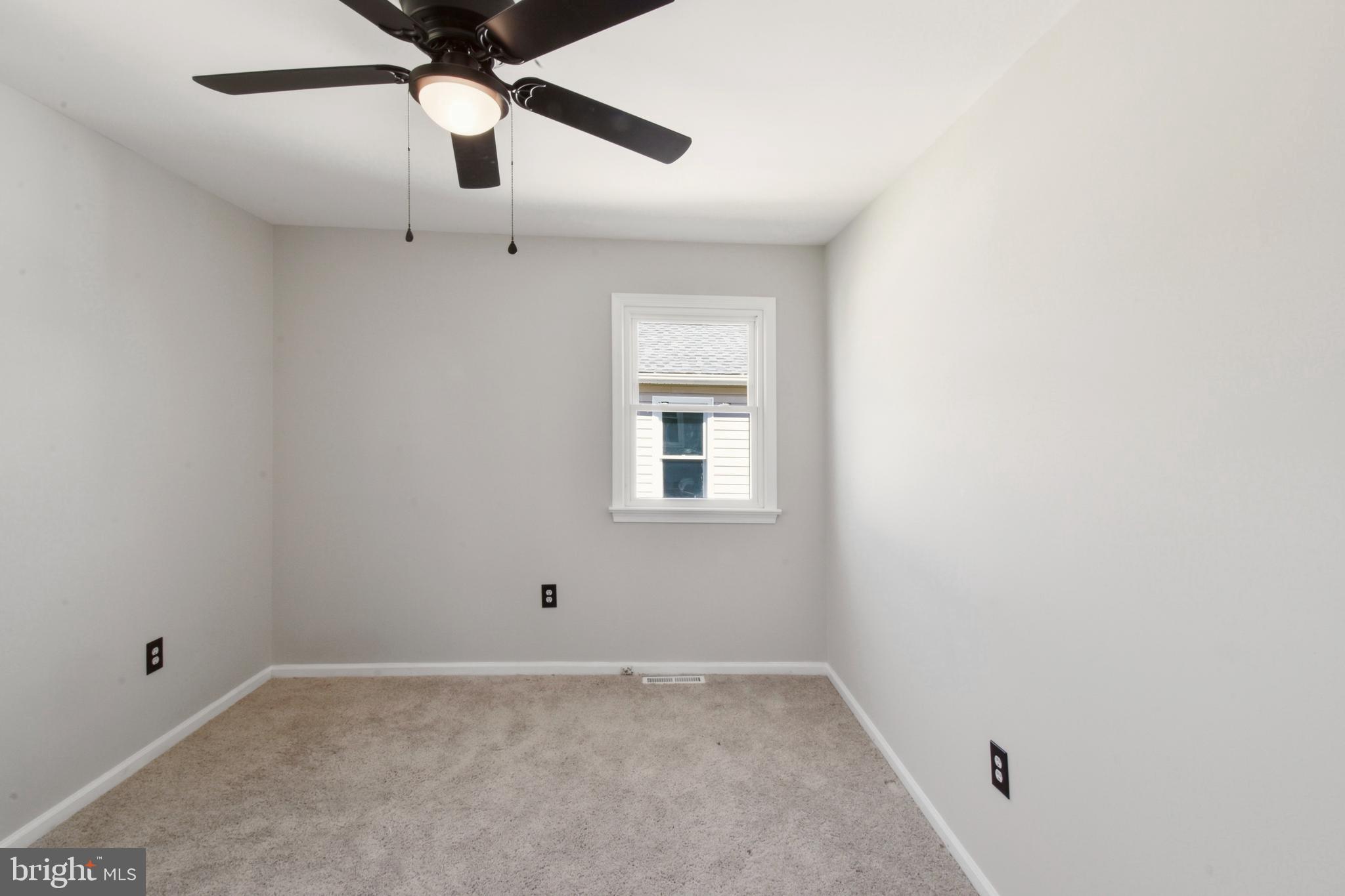 620 B Street Staunton, VA 24401 - Photo 7 of 26 an empty room with a window and a fan
