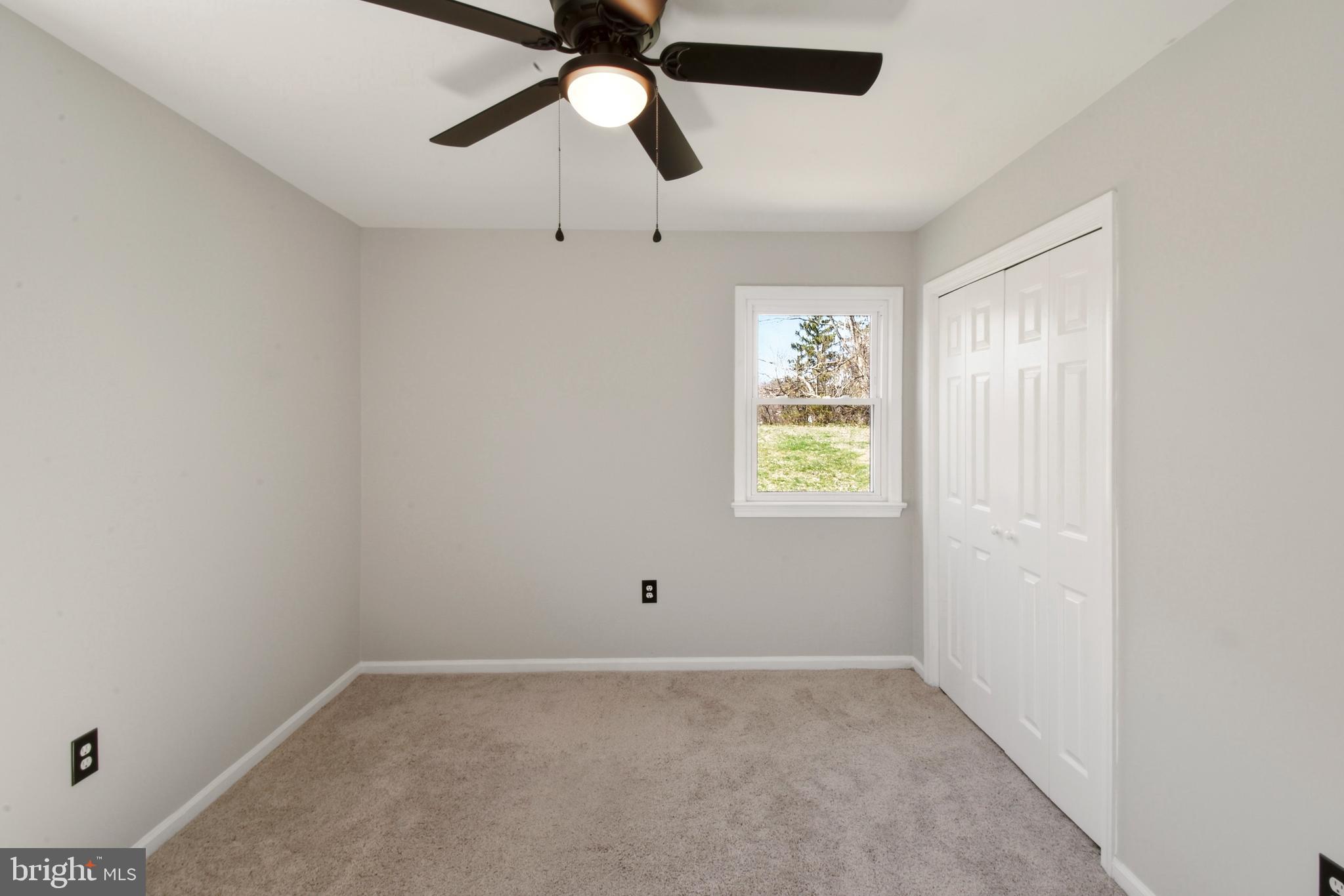 620 B Street Staunton, VA 24401 - Photo 9 of 26 an empty room with a window and a fan