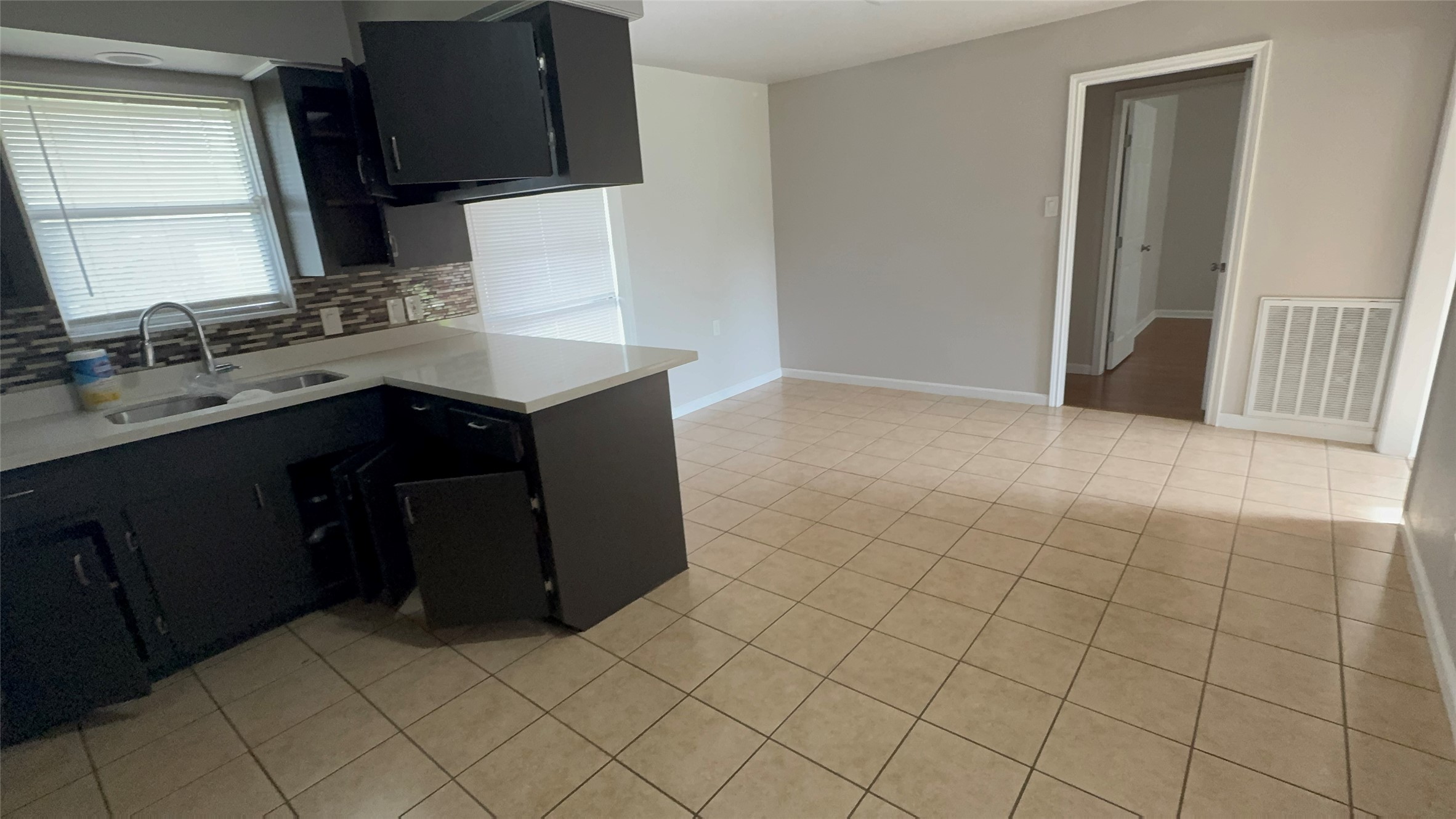 a kitchen with stainless steel appliances a sink stove and cabinets