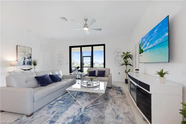 a living room with furniture and a flat screen tv
