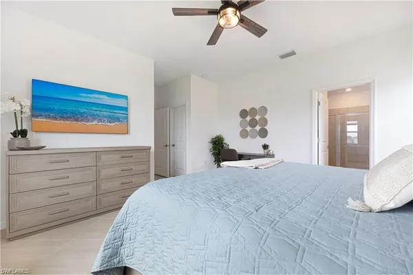 a bathroom with double vanity sinks and a shower