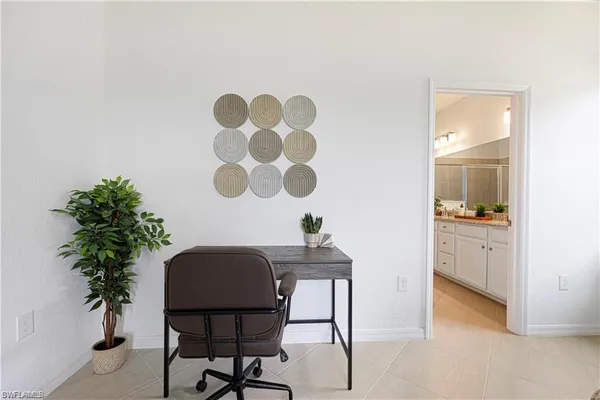a en suite bathroom with double sink and a mirror