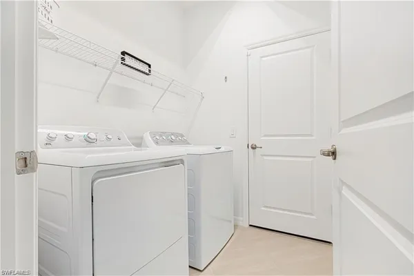 a view of a sign board with potted plants