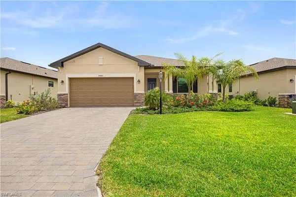 an aerial view of residential houses with outdoor space and swimming pool