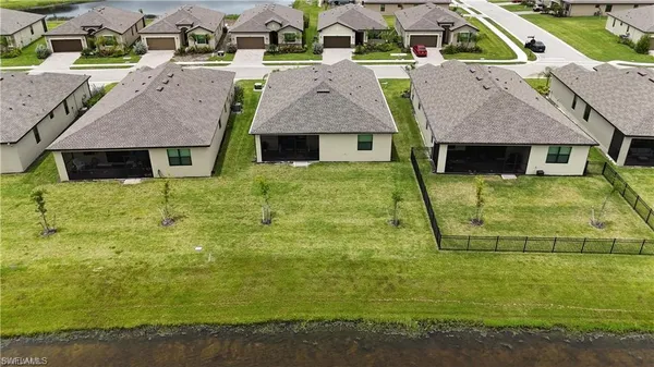 an aerial view of a house with outdoor space