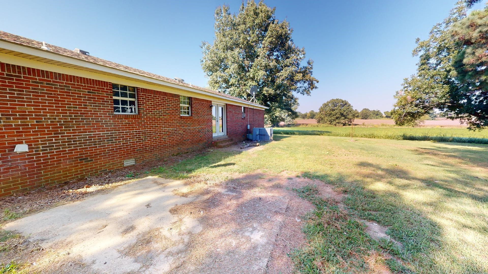 296 Enochs Road Newbern, TN 38059 - Photo 12 of 14 a view of back yard of the house