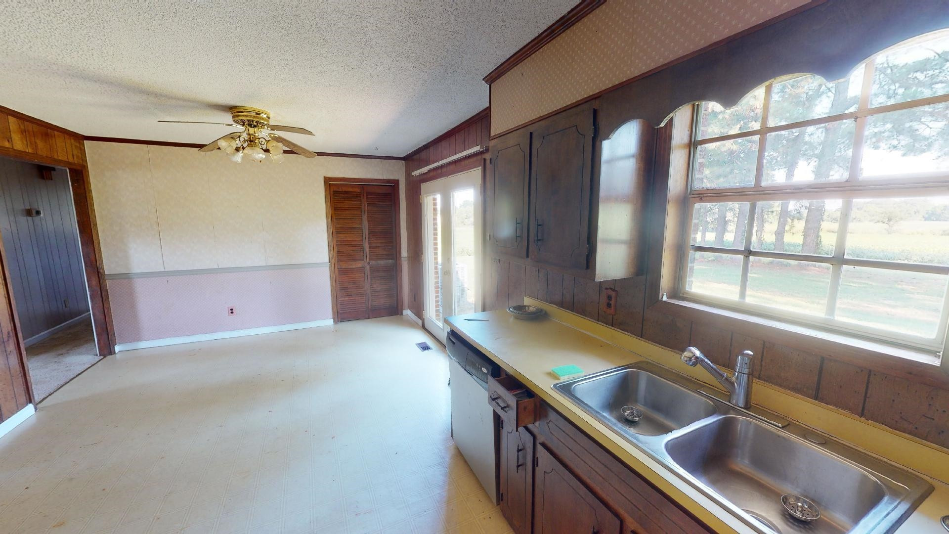 296 Enochs Road Newbern, TN 38059 - Photo 3 of 14 a kitchen with a sink and a large window