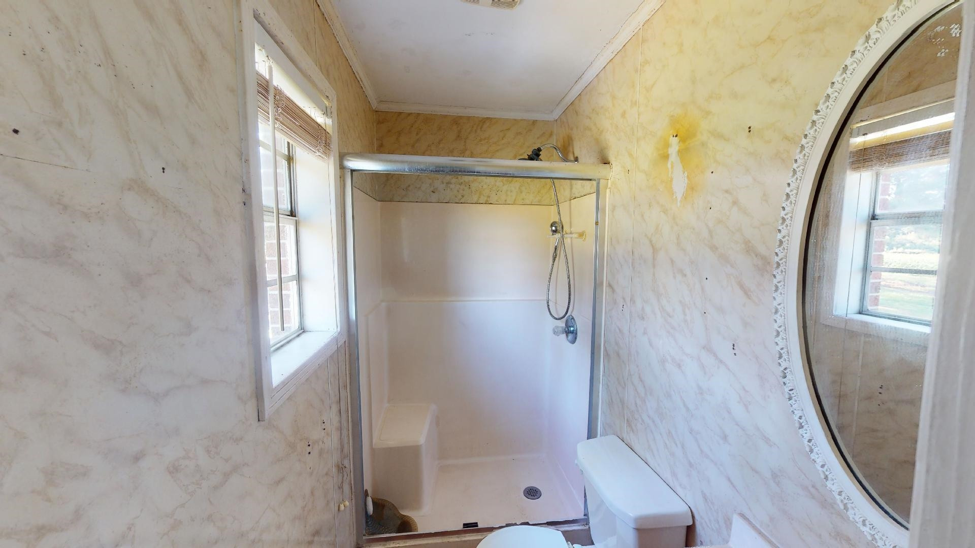 296 Enochs Road Newbern, TN 38059 - Photo 10 of 14 a bathroom with a glass shower door