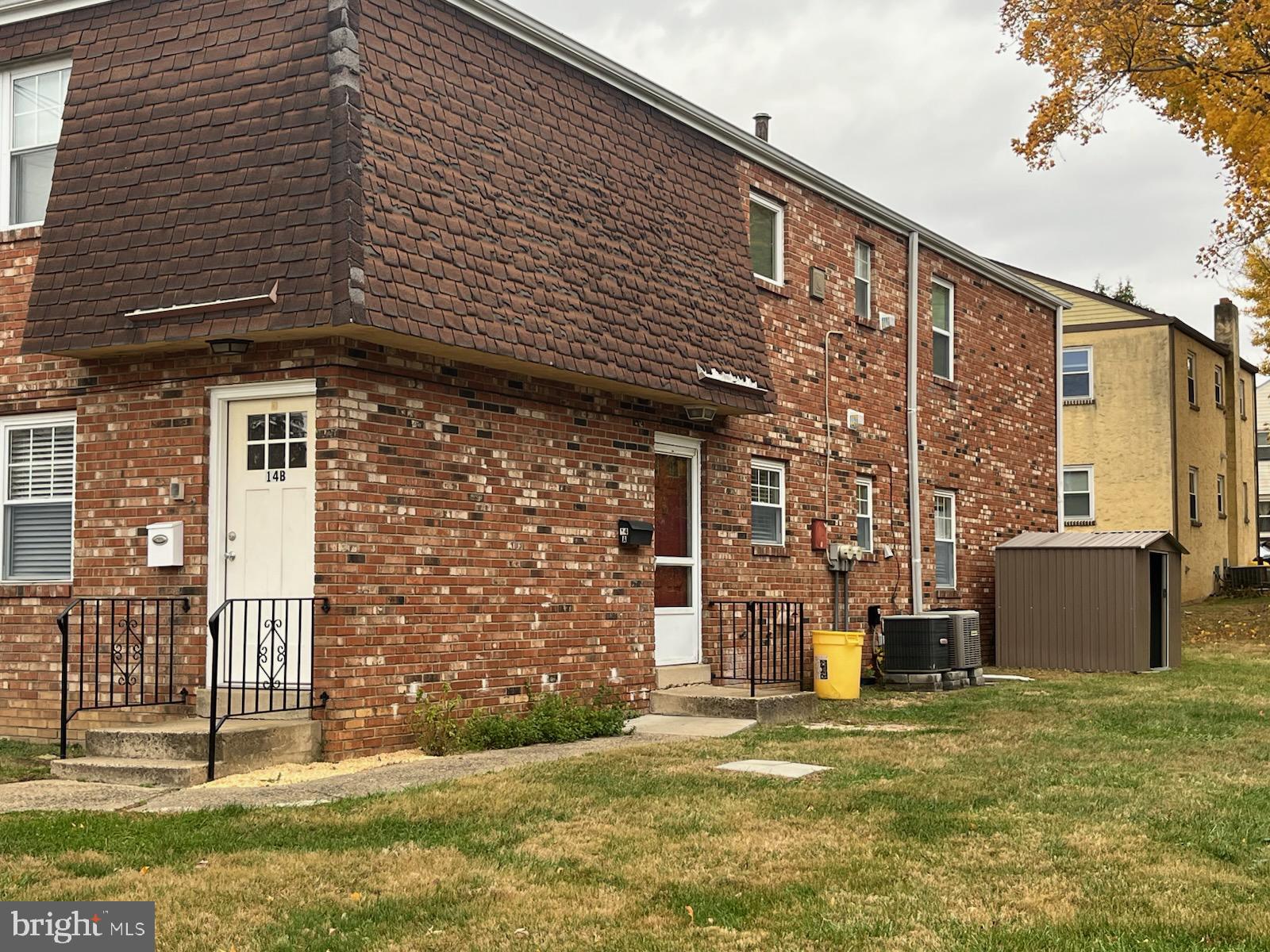 16 Apel Avenue, Unit D Oreland, PA 19075 - Photo 2 of 10 a front view of a house with a garden